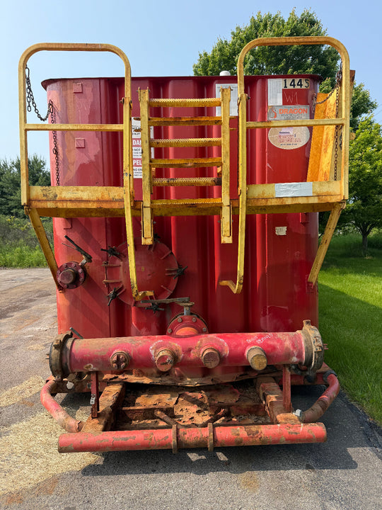 Front of red Dragon flat top frac tank #1445