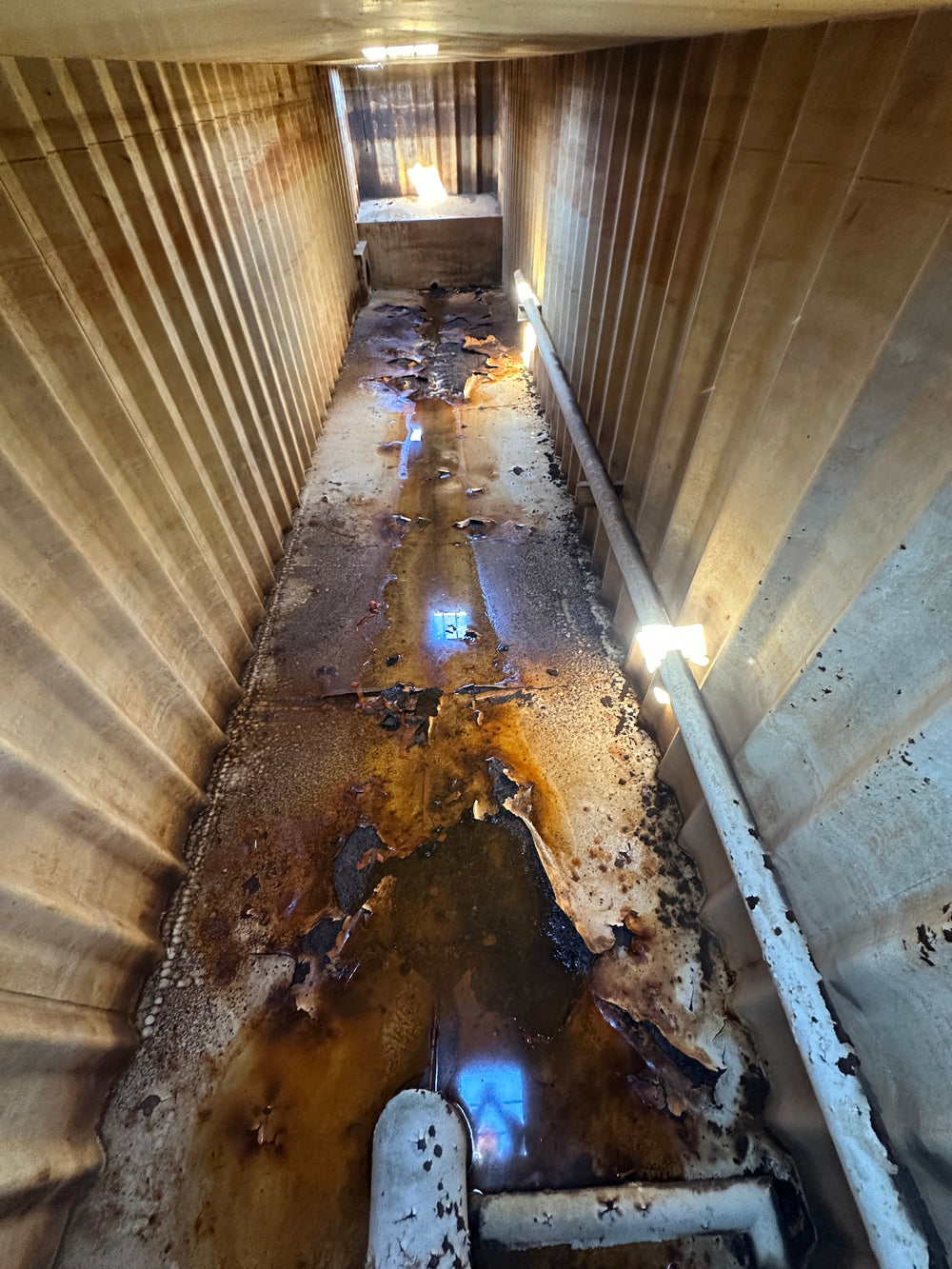 The interior of yellow Wichita 21,000 gallon frac tank #GP50011