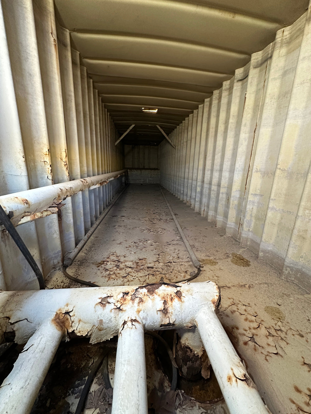 The interior of yellow Wichita 21,000 gallon frac tank #GP53060