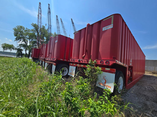 Rear view of red Dragon flat top frac tanks